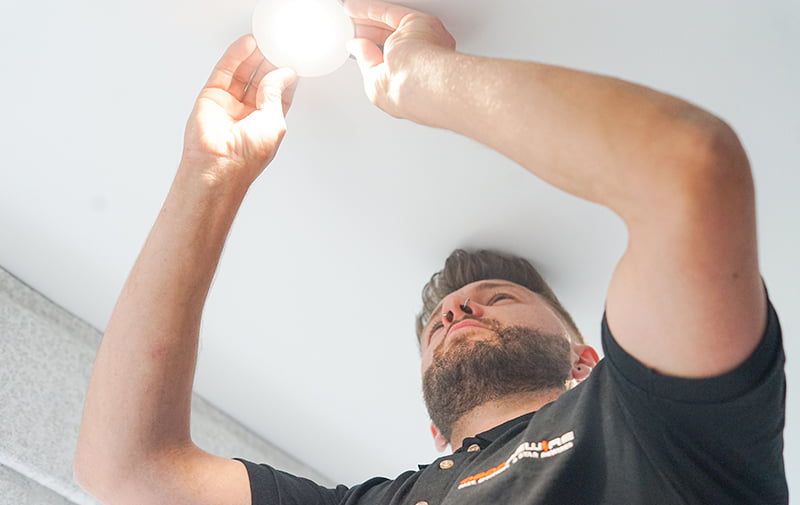 A man fitting false ceiling light